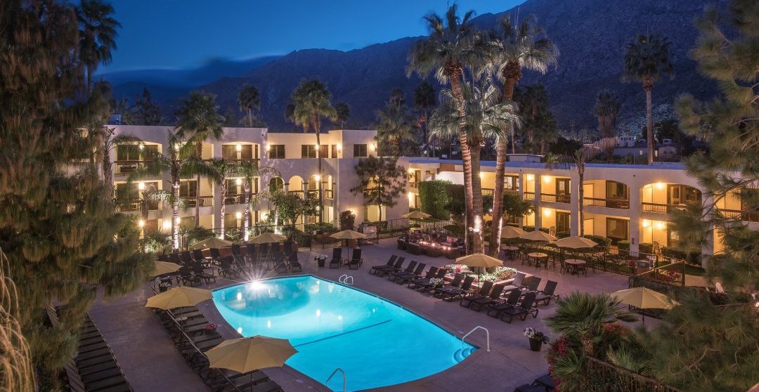 Palm Mountain Resort with mountains behind dusk Palm Springs Desert Oasis